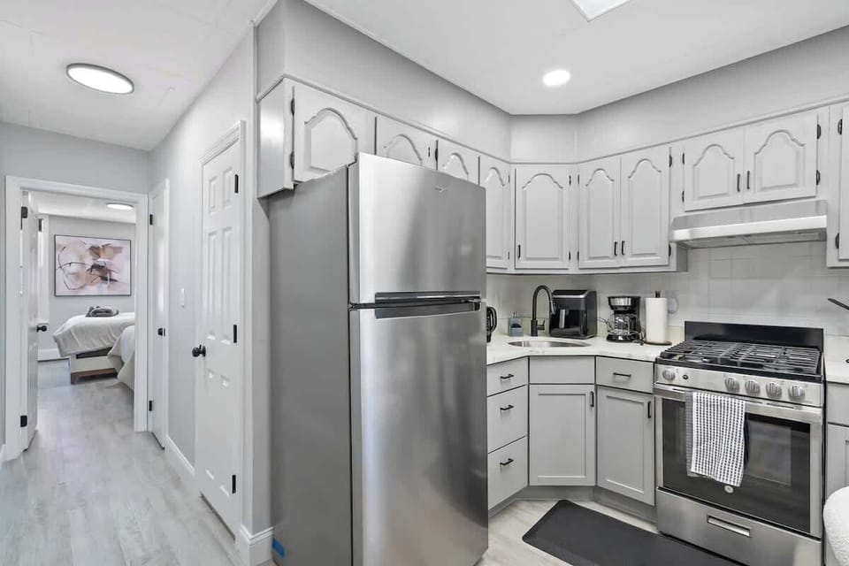 Kitchenware, utensils, and coffee maker provided.