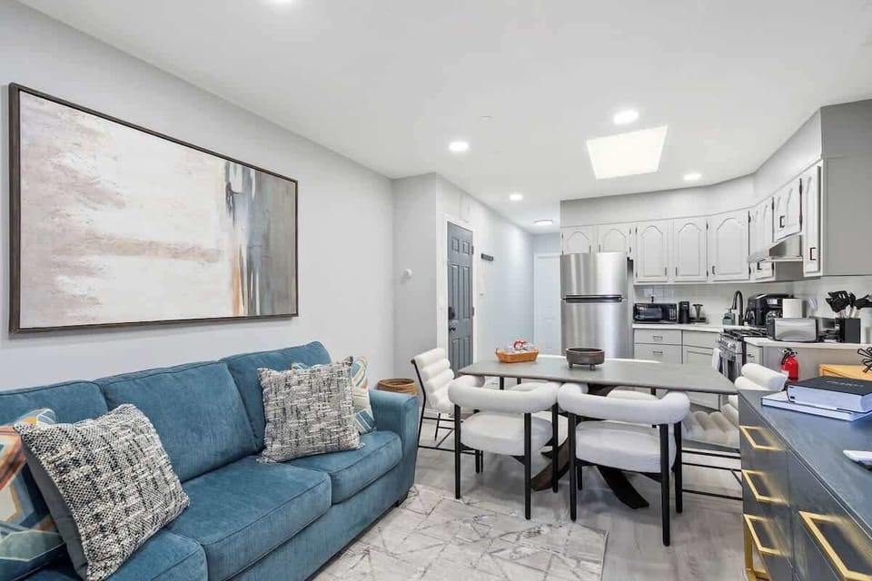 Bright and spacious living room with a queen sofa bed for extra guests.