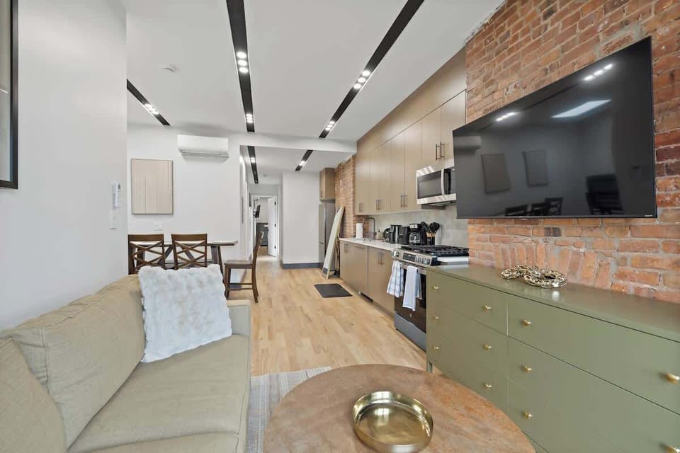 Spacious living area with a queen sofa bed and modern furnishings.