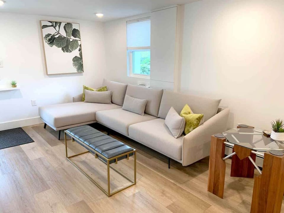 The living room has a smart TV and is open to the rest of the space. Car parking is directly outside the door for easy access!