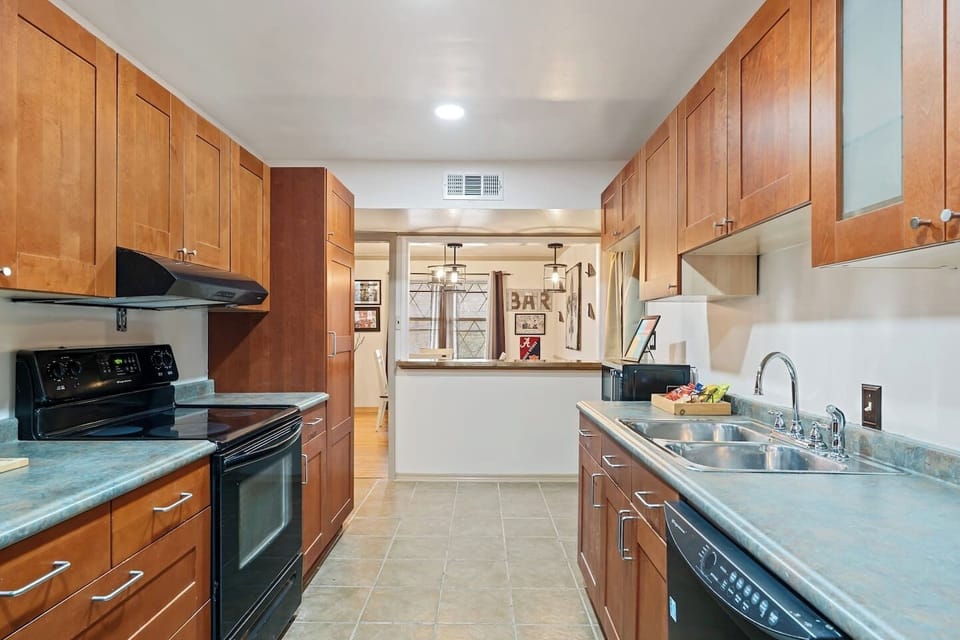 Cook like you`re at home with full kitchen featuring stove, oven, microwave, and dishwasher.