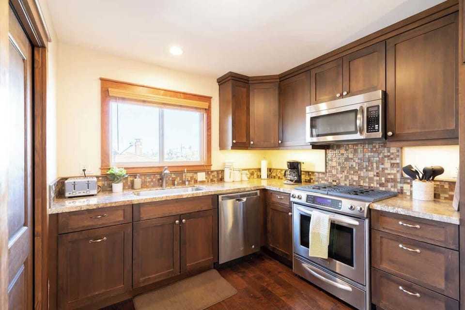 The modern kitchen comes fully equipped with everything you need for your stay