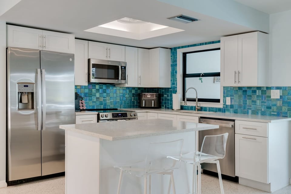 Fully equipped and remodeled kitchen over looking the dining and living room