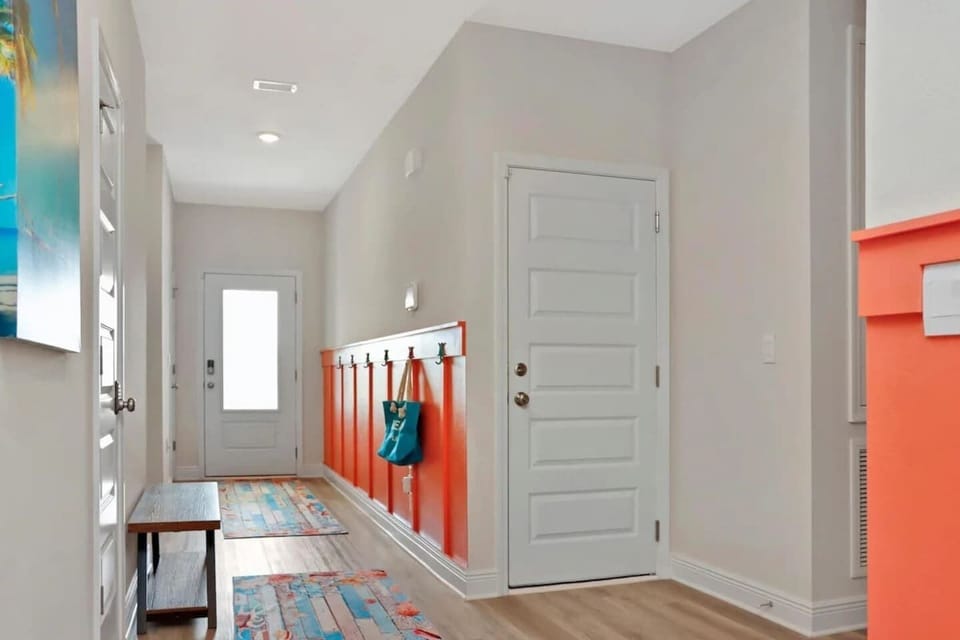 Spacious foyer with clean lines and coastal touches.