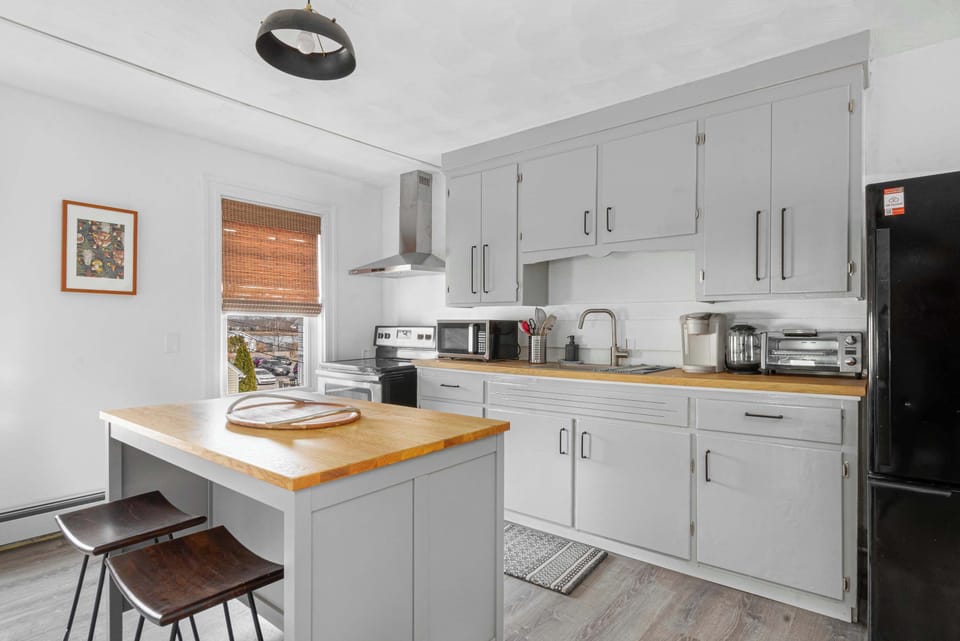 Open, bright, and ready to serve—our kitchen is basically an invitation to gather, laugh, and eat your way through vacation.