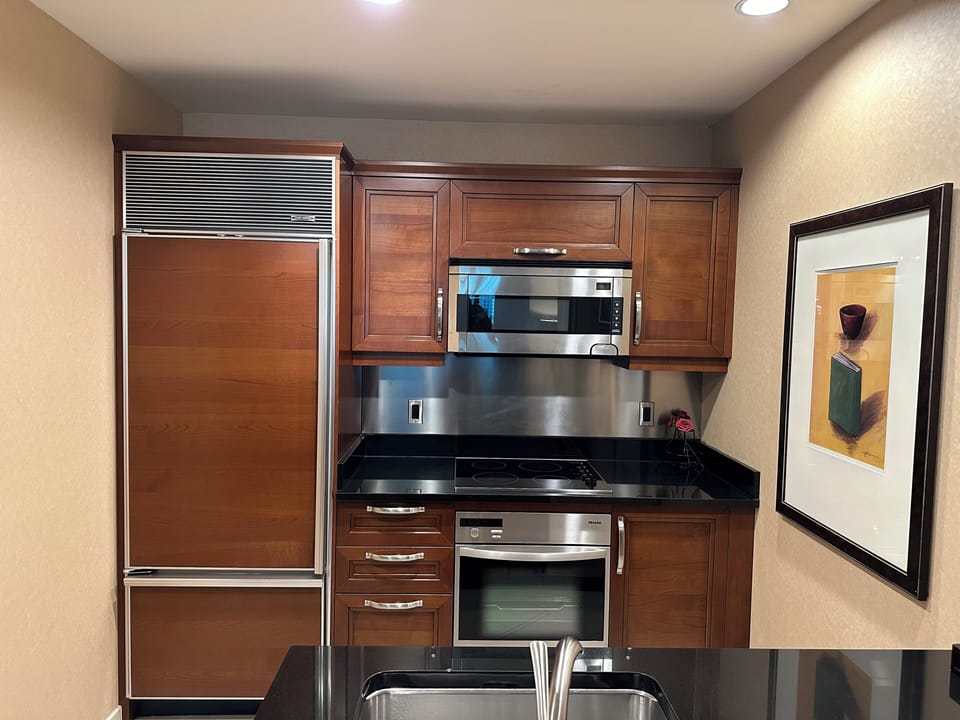 Full kitchen with built-in SubZero fridge and freezer, stove top, and oven