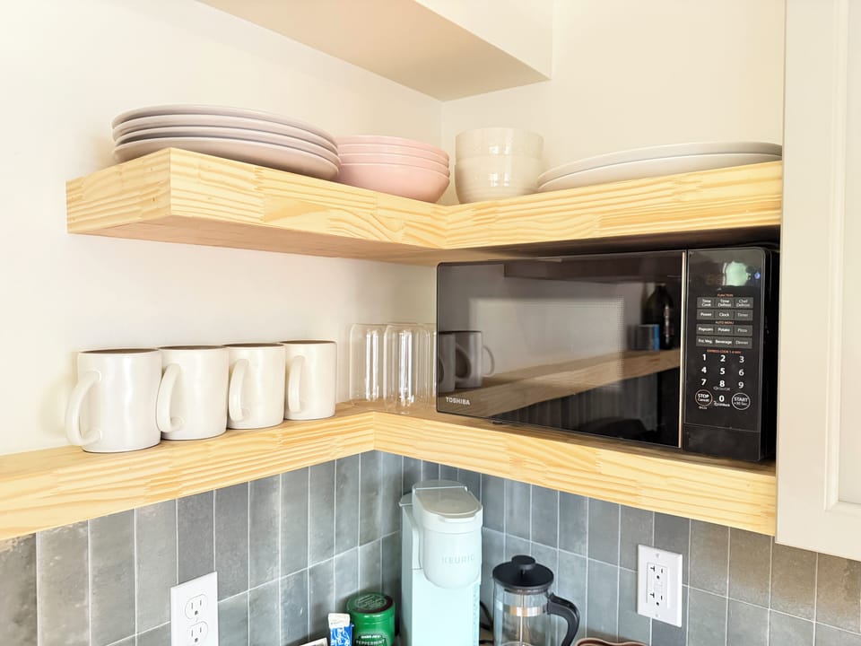 Microwave and coffee bar with decaf options.
