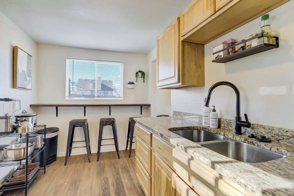Enjoy your morning at the breakfast bar, which features three stools set against a window overlooking the backyard. It’s the perfect spot to enjoy a drink from our complimentary coffee station.