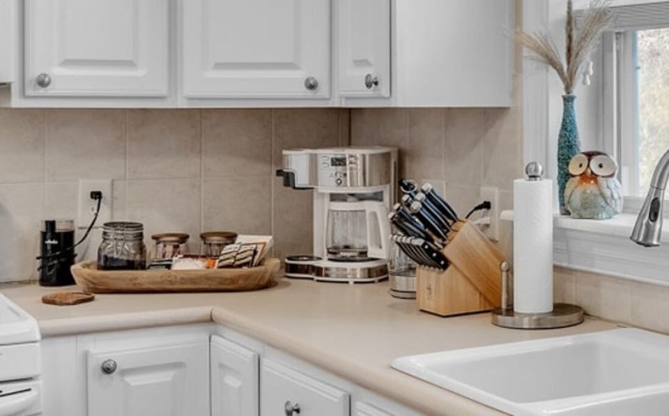 Coffee, Tea, Hot Coco station, with sweetners, cream and a coffee bean grinder.