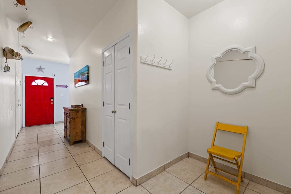Welcoming entry with a pop of island color