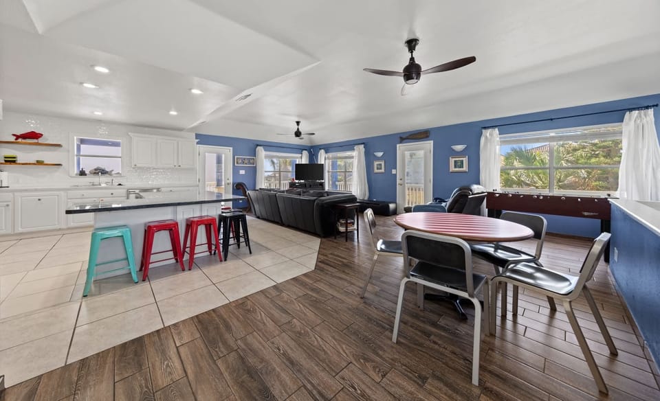 Bright open-concept living, dining, and kitchen upstairs