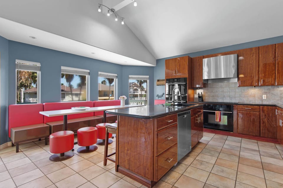 The open kitchen flows into a fun dining nook