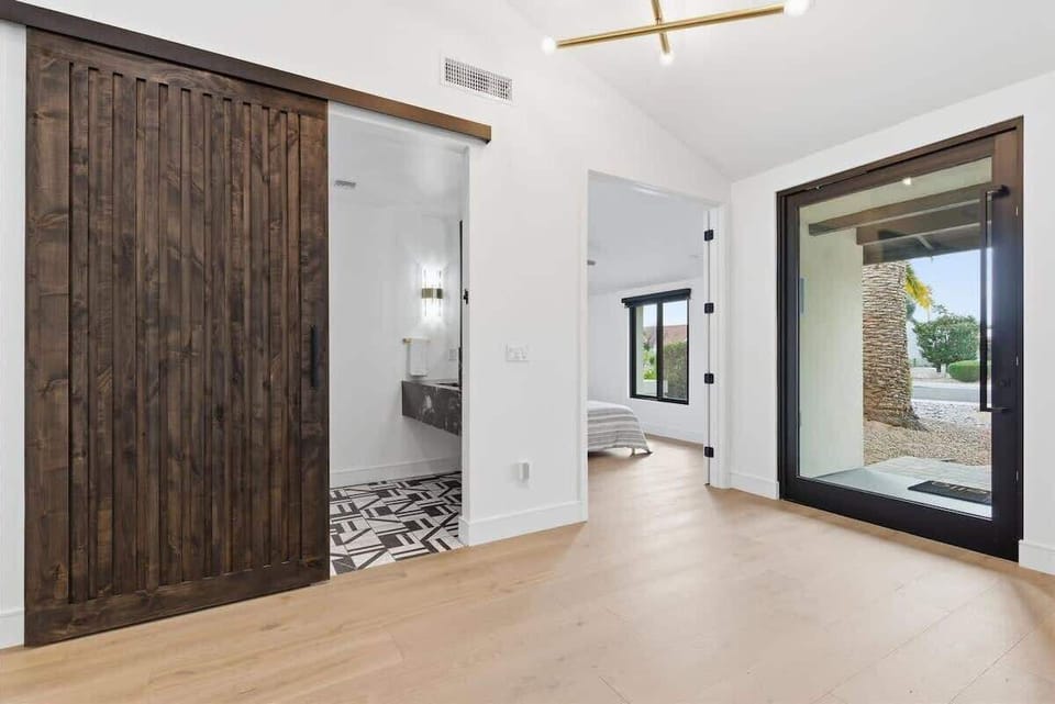 Half Bathroom right by the front door entrance featuring a single vanity.