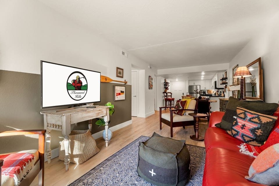 Open Floor Plan Includes a Fully Equipped Kitchen, Living Space with Cozy Furniture, Streaming Capable TV, + Live Channels, Patio Access, Creek View, 2 Bedrooms and 2 Bathrooms!