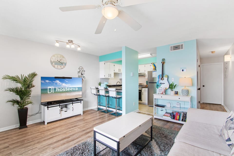 Signature Condo, 1 Bedroom, Balcony, Beach View | Living room | 32-inch Smart TV with satellite channels