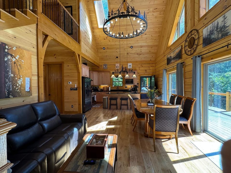 Main floor living, dining and kitchen area.  Access to main level deck.