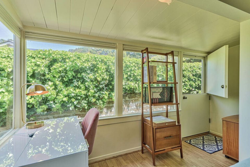 A Cozy Work Area with Desk and Peek of the Ocean
