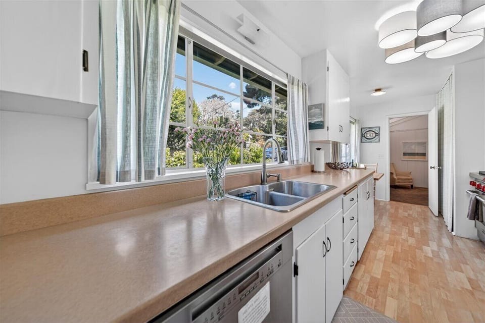 Kitchen has a View of the Backyard Garden