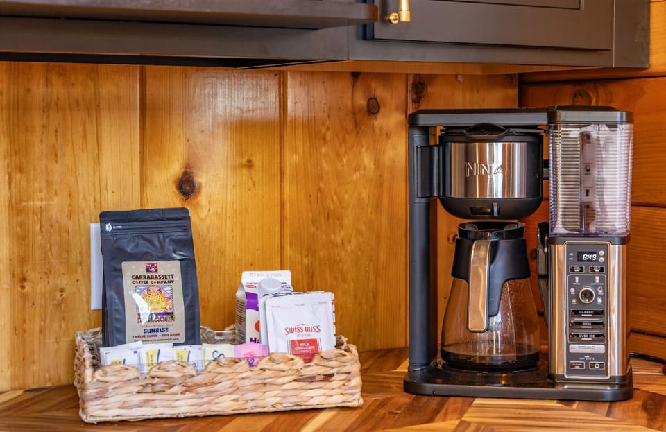 Drip coffee maker with Maine coffee, sugars, creamer