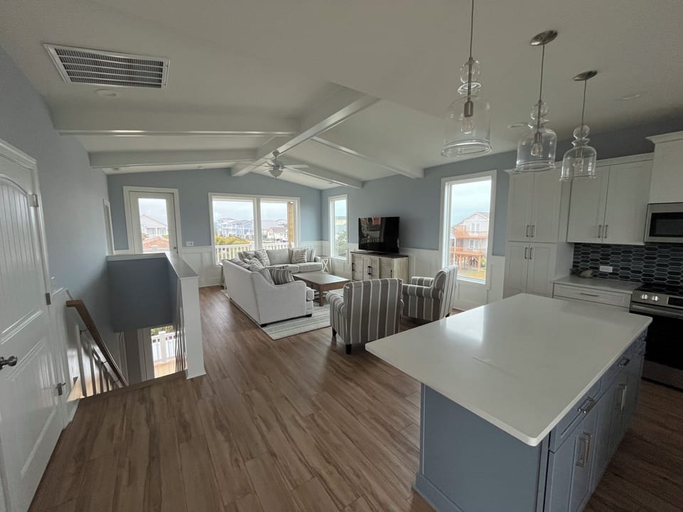 Open floor plan that connects the kitchen, dining room, and living room