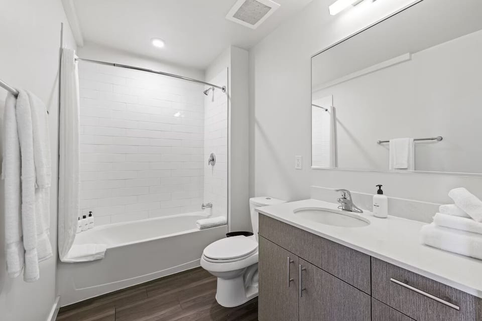 Refresh and recharge in a bright bath with tub-shower combo.
