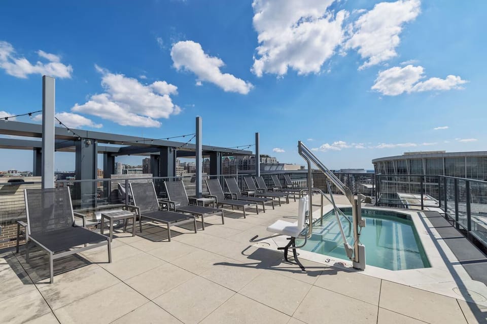 Soak up the sun beside the rooftop pool and loungers.