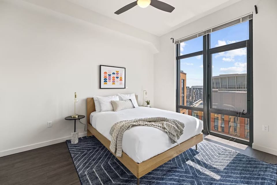 Wake up to sunshine and skyline views from bed.