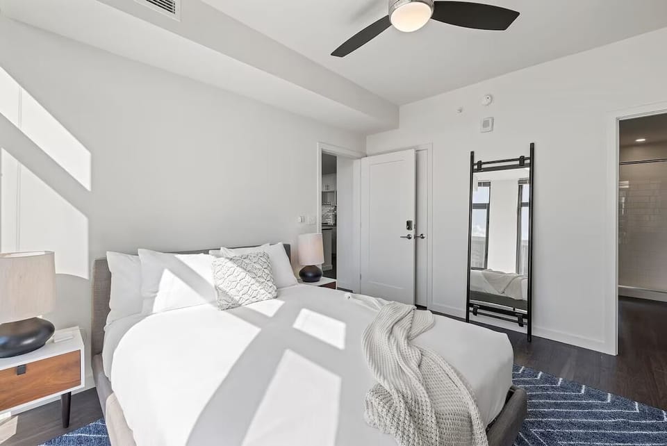 Stretch out comfortably in this serene, sunlit bedroom retreat.