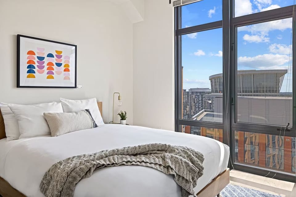 Lounge in crisp linens and savor the skyline panorama.