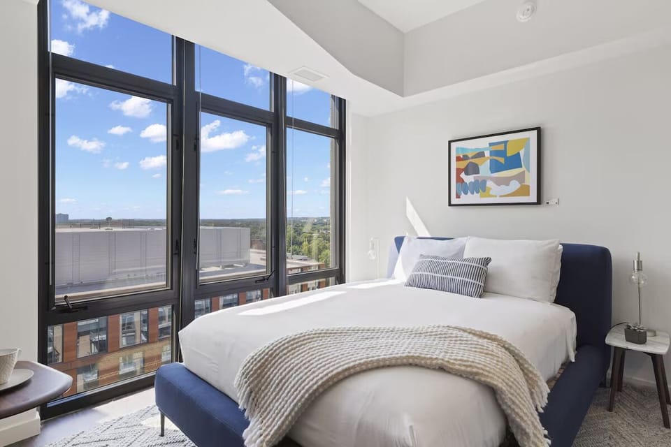 Wake up refreshed in sunlit comfort with skyline views.