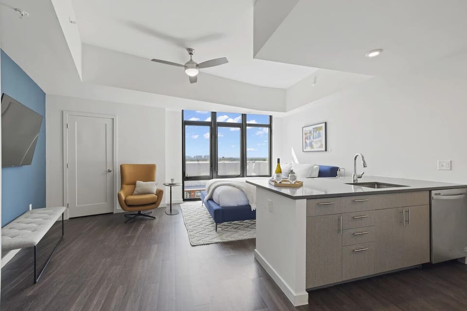 Spread out in an airy studio with sleek, modern finishes.