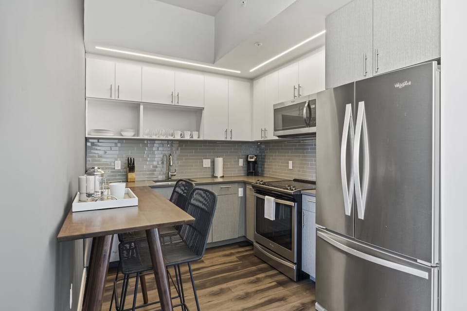 Brew morning coffee and prep snacks in the sleek kitchen.