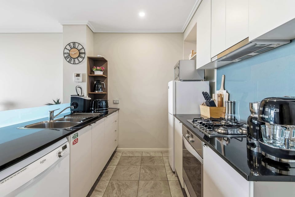 A sleek, fully-equipped kitchen perfect for whipping up everything from snacks to gourmet meals.