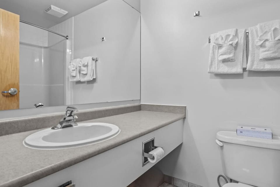 A serene bathroom ready for a quick refresh after a long day of exploring.