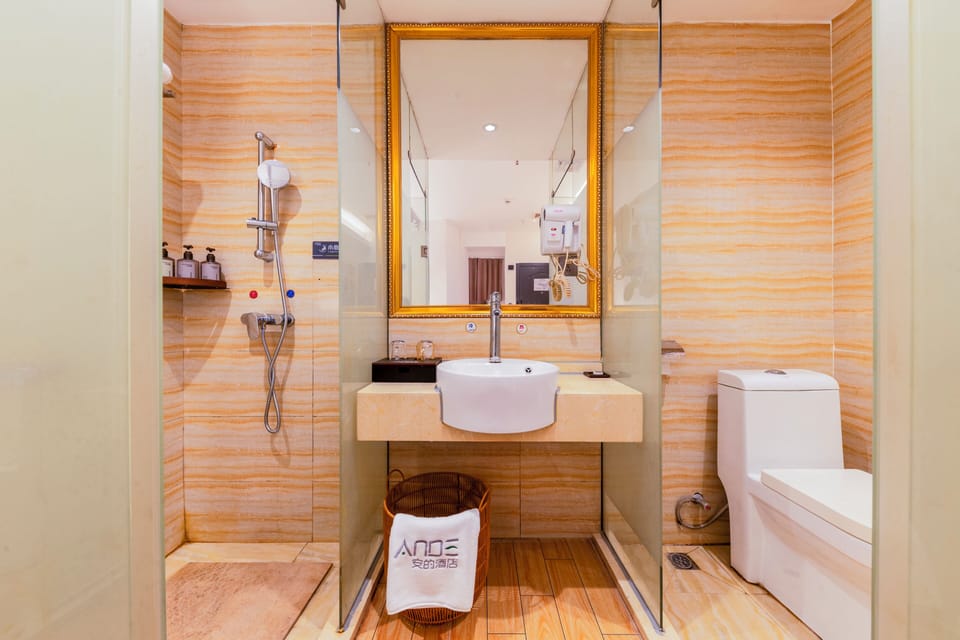 Shower, hair dryer, slippers, towels