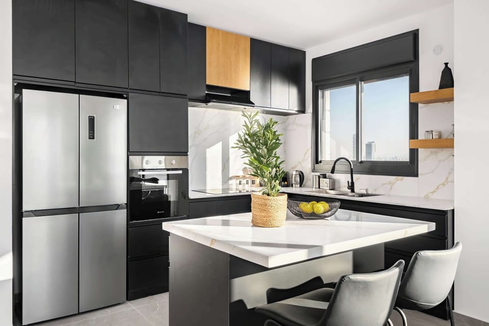 Sleek chef-inspired kitchen with statement island, premium finishes elevate everyday cooking into a refined experience