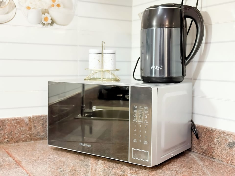 Family Apartment, Balcony, City View | Private kitchen | Electric kettle