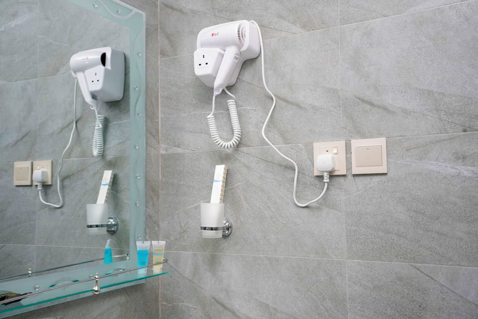 Separate tub and shower, hair dryer, slippers, bidet