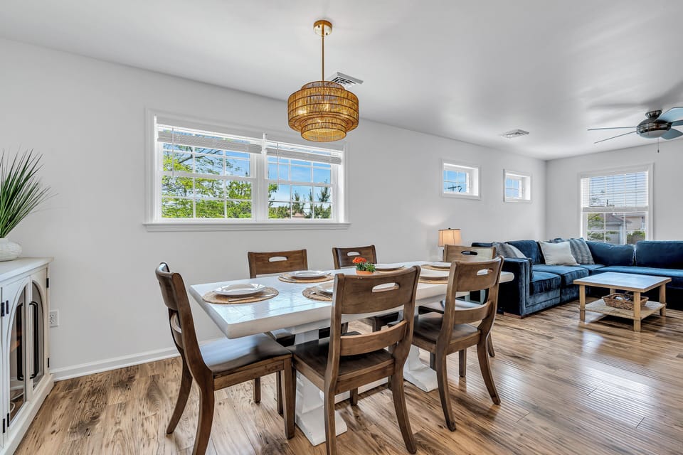 Dining table for 6 guests with additional chairs in garage
