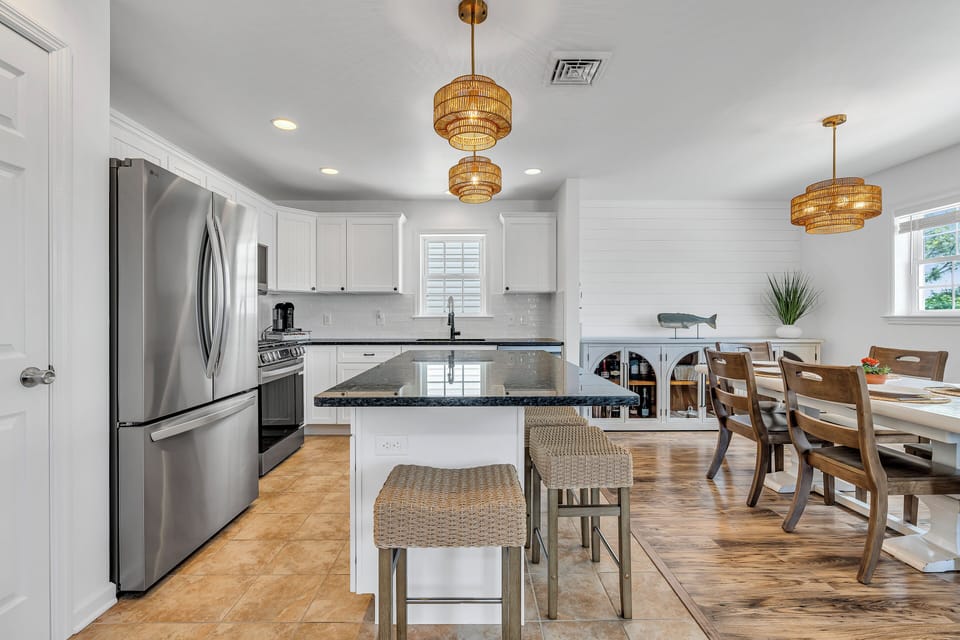 Fully stocked kitchen w/ gas stove, microwave, dishwasher, coffee maker