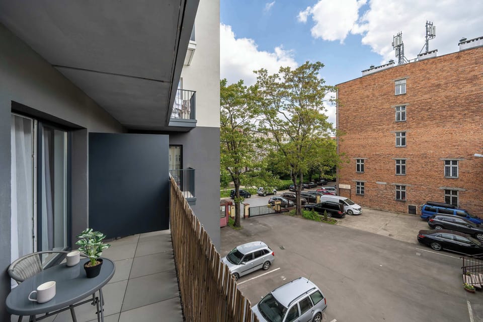 The courtyard view from the balcony adds charm to everyday moments in the apartment.