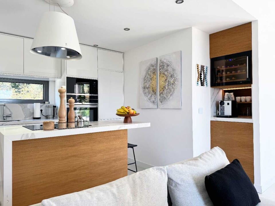 Villa | Private kitchen | Highchair, cleaning supplies
