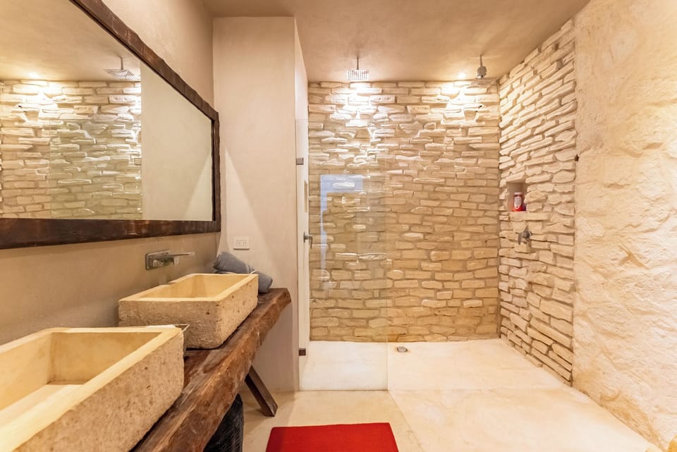 Deluxe Suite, Sea View | Bathroom | Shower, hair dryer, towels, soap
