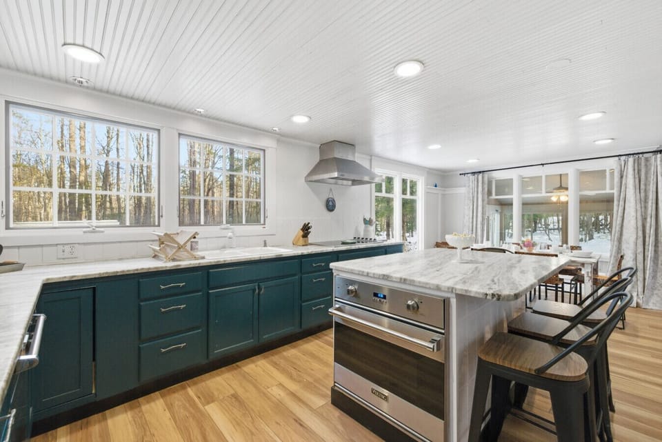 Modern kitchen island with seating and bright windows