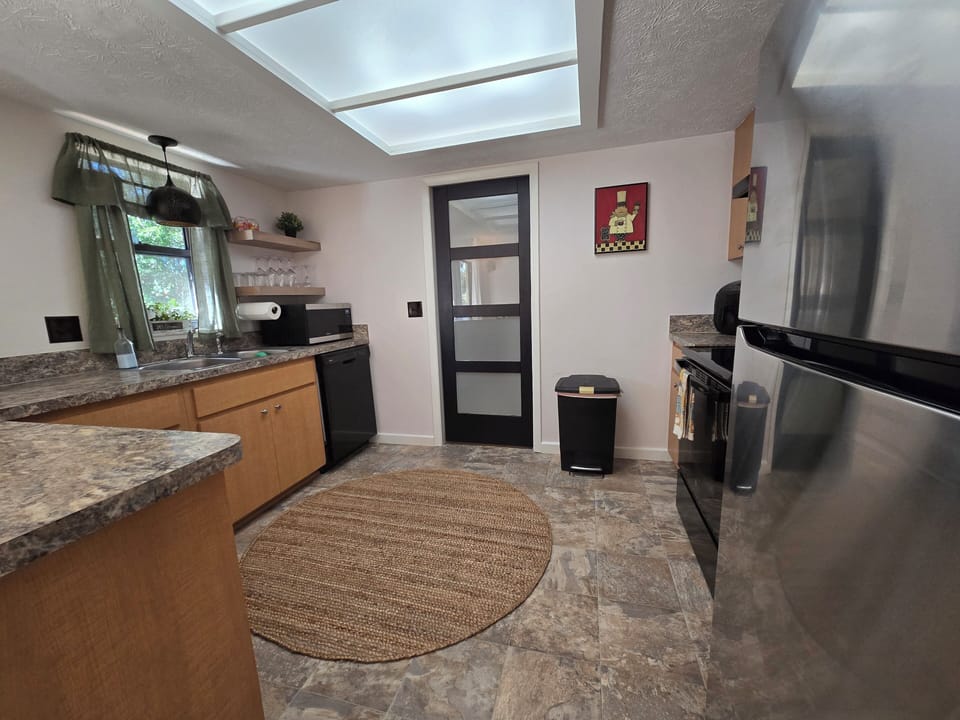 kitchen and the door that leads to the laundry area and the  garage