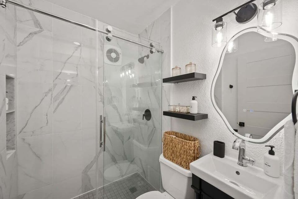 Lovely bathroom with Public Goods Shampoo, Conditioner, Lotion and bath products