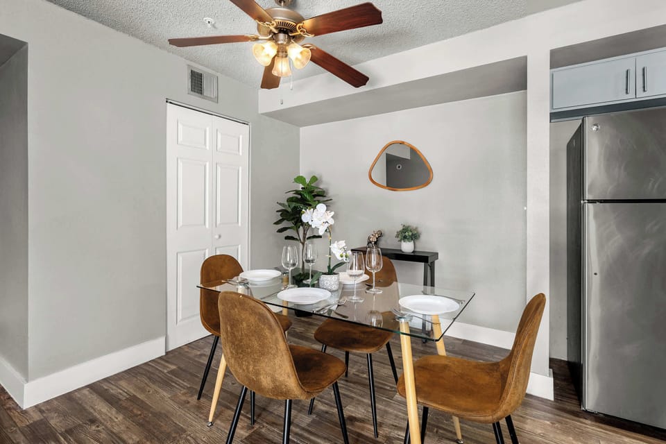 Elegant dining area with seating for four, plus a high chair for added convenience.