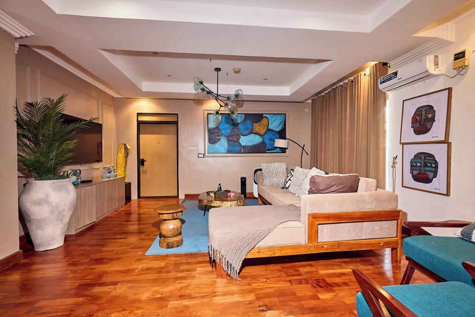 Luxury Apartment, Garden View | Living area | Flat-screen TV