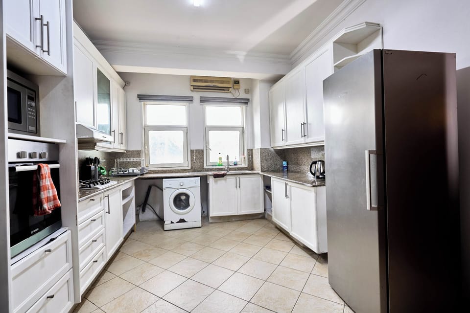 Luxury Apartment, Garden View | Private kitchen | Microwave, oven, stovetop, electric kettle