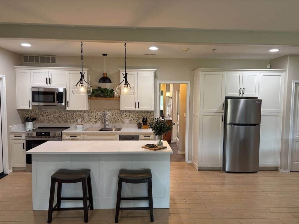 Brand new kitchen with quart countertops, GE appliances, a dishwasher and plenty of storage. We provide everything you'll need to cook, serve, and enjoy your stay!